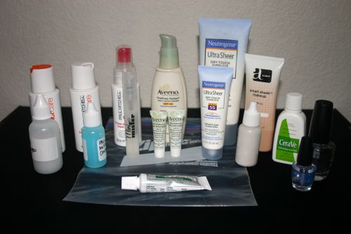 Travel toiletries in the back, with their smaller siblings in the front.